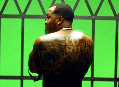 flo rida back tattoo. shoulder ack tattoo butterfly