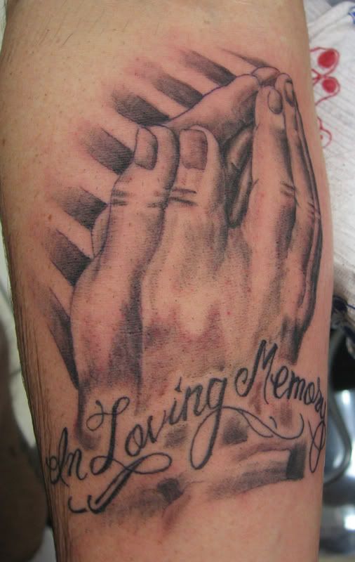praying hands tattoo on forearm Image