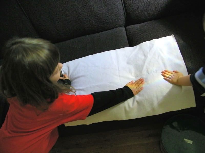 kids with their hands on the rainbow